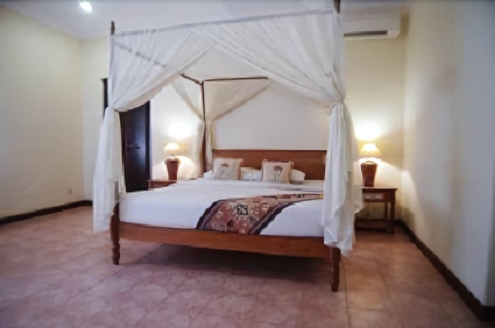 Imagen de la habitación del Hotel The Benoa Beach Front Villas and Spa. Foto 11