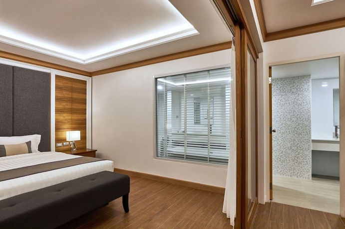 Imagen de la habitación del Hotel The Beverly Pattaya. Foto 5