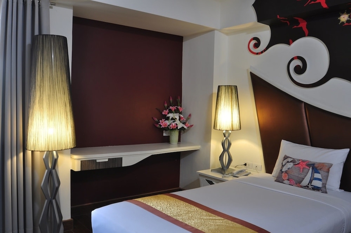 Imagen de la habitación del Hotel The Beverly Pattaya. Foto 12