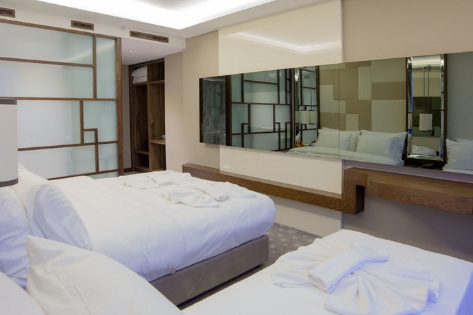 Imagen de la habitación del Hotel The Biancho Pera. Foto 10