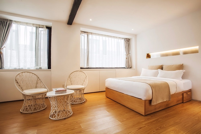 Imagen de la habitación del Hotel The Bivou Lijiang. Foto 2