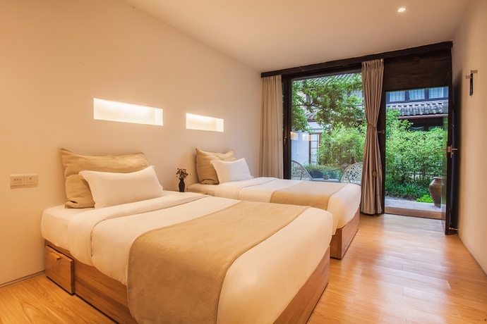 Imagen de la habitación del Hotel The Bivou Lijiang. Foto 17
