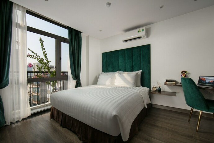 Imagen de la habitación del Hotel The Bloom Ha Noi. Foto 14