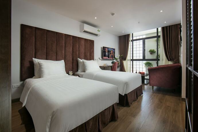 Imagen de la habitación del Hotel The Bloom Ha Noi. Foto 18