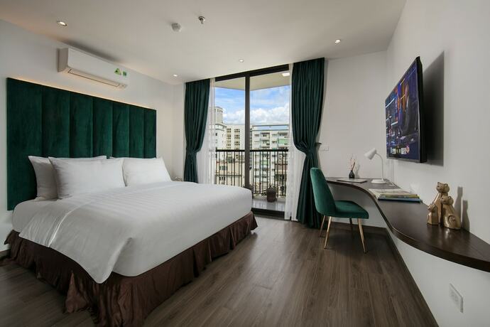 Imagen de la habitación del Hotel The Bloom Ha Noi. Foto 24