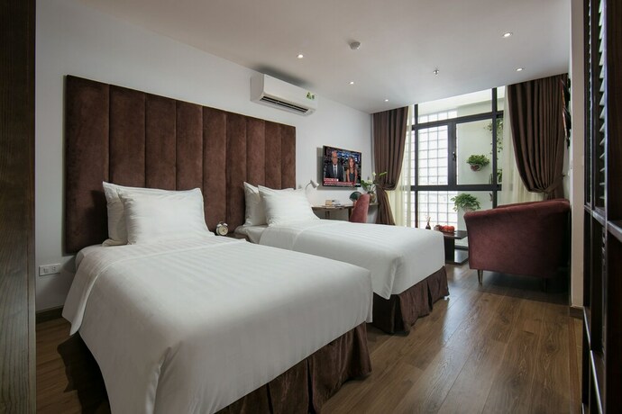 Imagen de la habitación del Hotel The Bloom Ha Noi. Foto 34