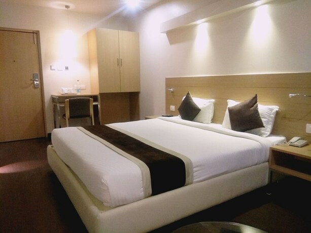 Imagen de la habitación del Hotel The Blossom. Foto 16