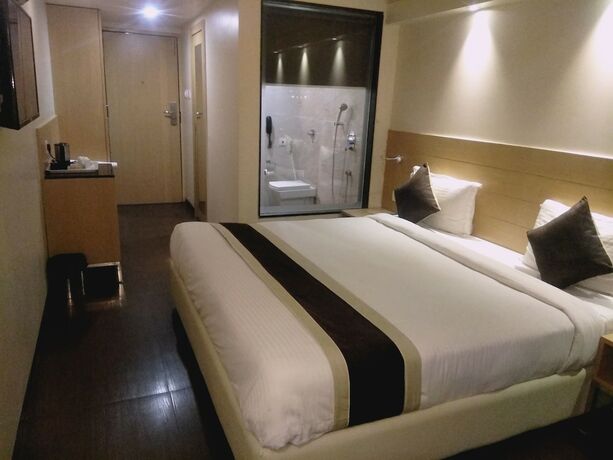 Imagen de la habitación del Hotel The Blossom. Foto 17