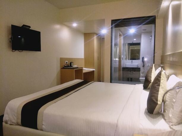 Imagen de la habitación del Hotel The Blossom. Foto 22