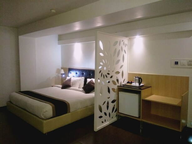 Imagen de la habitación del Hotel The Blossom. Foto 23