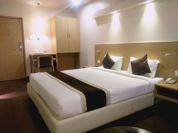 Imagen de la habitación del Hotel The Blossom. Foto 27