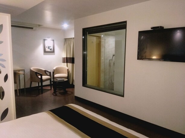 Imagen de la habitación del Hotel The Blossom. Foto 35