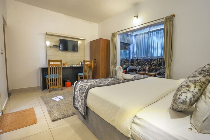 Imagen de la habitación del Hotel The Blossom Resort. Foto 14