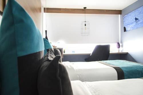 Imagen de la habitación del Hotel The Blue Hotel. Foto 5