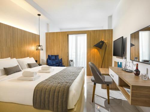 Imagen de la habitación del Hotel The Blue Ivy and Suites. Foto 3