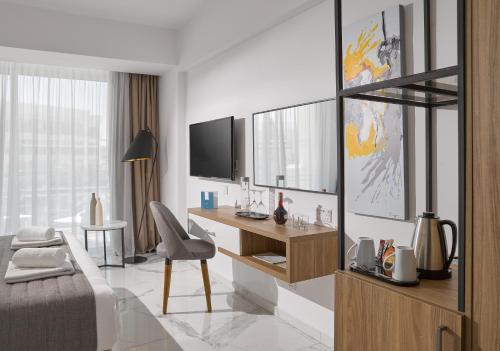 Imagen de la habitación del Hotel The Blue Ivy and Suites. Foto 4