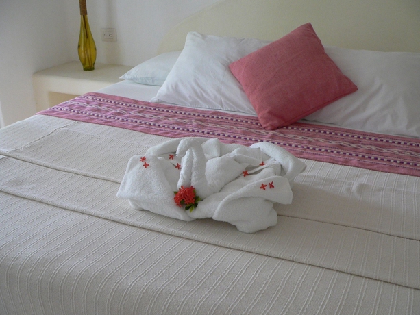 Imagen de la habitación del Hotel The Blue Pearl Suites. Foto 5