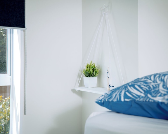 Imagen de la habitación del Hotel The Boathouse Lodge. Foto 12