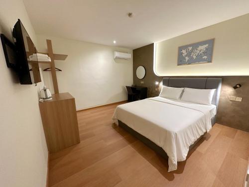 Imagen de la habitación del Hotel The Borneo. Foto 16