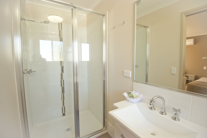 Imagen de la habitación del Hotel The Bowlo Holiday Cabins. Foto 15