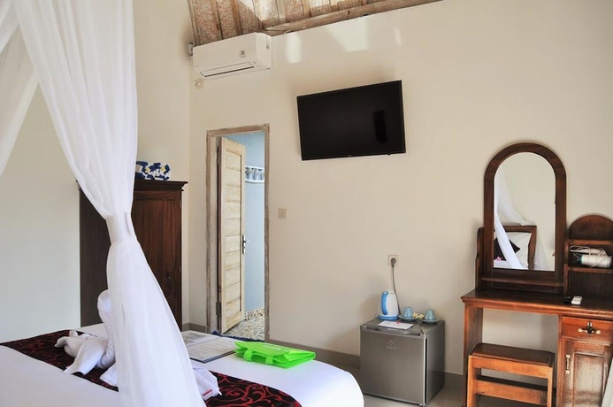 Imagen de la habitación del Hotel The Box Paradise Bungalow. Foto 4