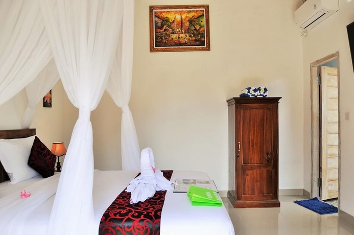 Imagen de la habitación del Hotel The Box Paradise Bungalow. Foto 6