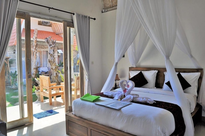 Imagen de la habitación del Hotel The Box Paradise Bungalow. Foto 8