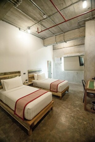 Imagen de la habitación del Hotel The Bricks. Foto 16