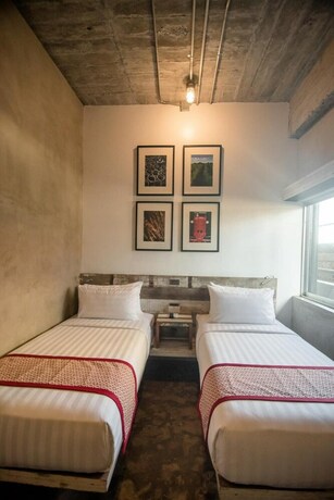 Imagen de la habitación del Hotel The Bricks. Foto 21