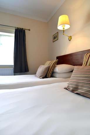 Imagen de la habitación del Hotel The Brickwall. Foto 15