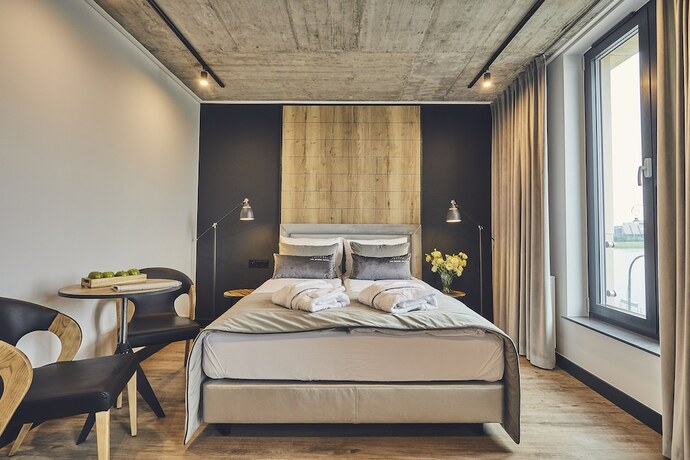 Imagen de la habitación del Hotel The Bridge Suites. Foto 12