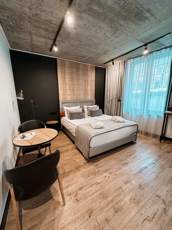 Imagen de la habitación del Hotel The Bridge Suites. Foto 16