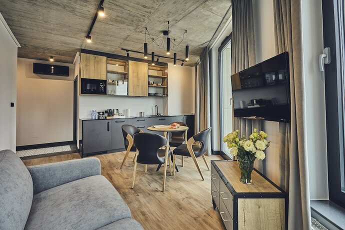 Imagen de la habitación del Hotel The Bridge Suites. Foto 19