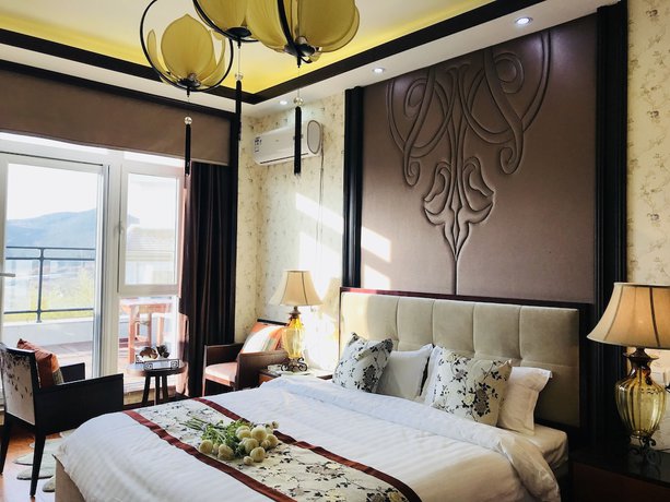 Imagen de la habitación del Hotel The Brigh Eco Hotel Yantai. Foto 6