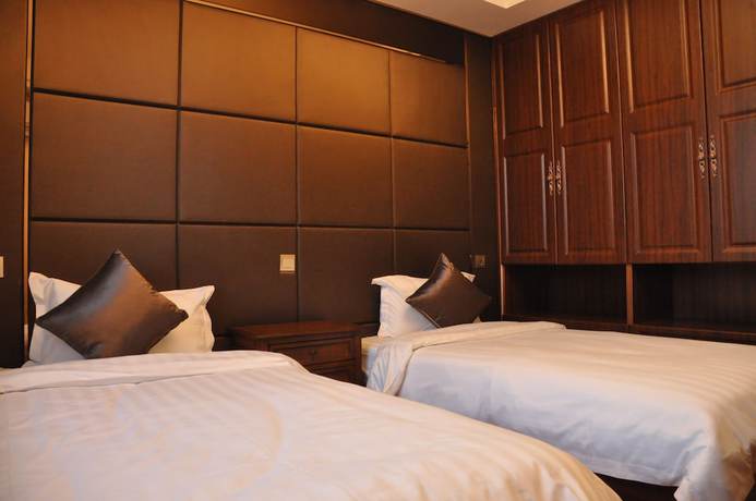 Imagen de la habitación del Hotel The Brigh Eco Hotel Yantai. Foto 10