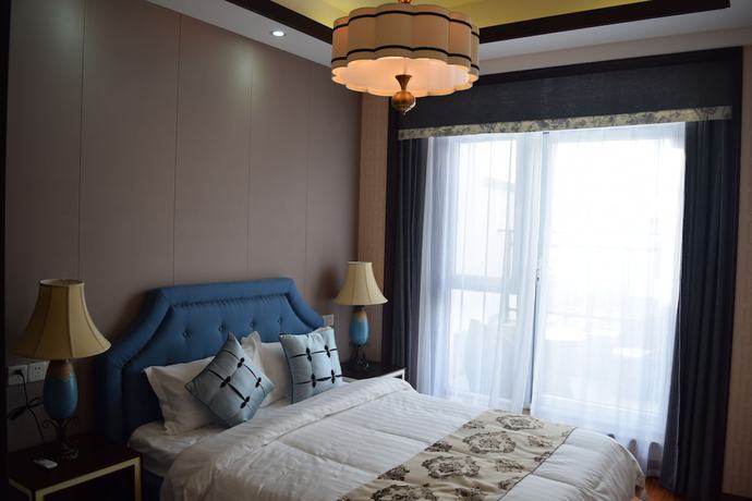 Imagen de la habitación del Hotel The Brigh Eco Hotel Yantai. Foto 11