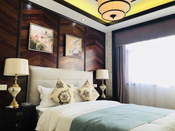 Imagen de la habitación del Hotel The Brigh Eco Hotel Yantai. Foto 14