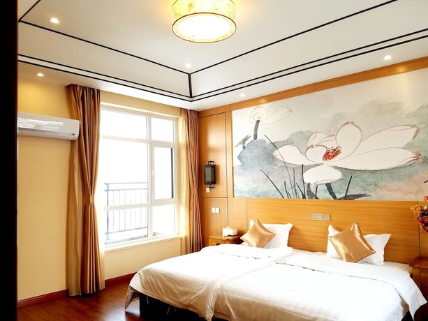 Imagen de la habitación del Hotel The Brigh Eco Hotel Yantai. Foto 16