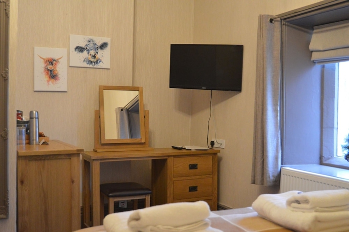 Imagen de la habitación del Hotel The Buck Inn. Foto 11