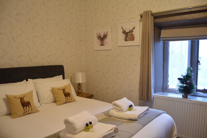 Imagen de la habitación del Hotel The Buck Inn. Foto 14