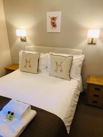 Imagen de la habitación del Hotel The Buck Inn. Foto 15