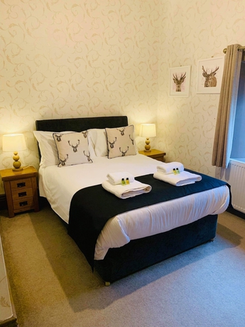 Imagen de la habitación del Hotel The Buck Inn. Foto 16