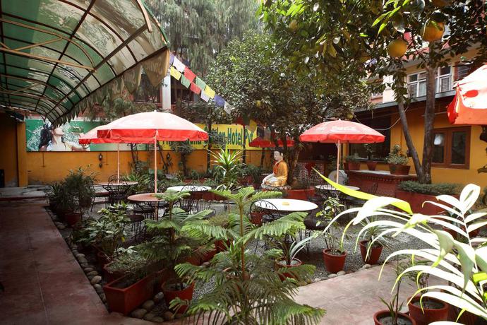 Imagen del bar/restaurante del Hotel The Buddha Garden. Foto 3