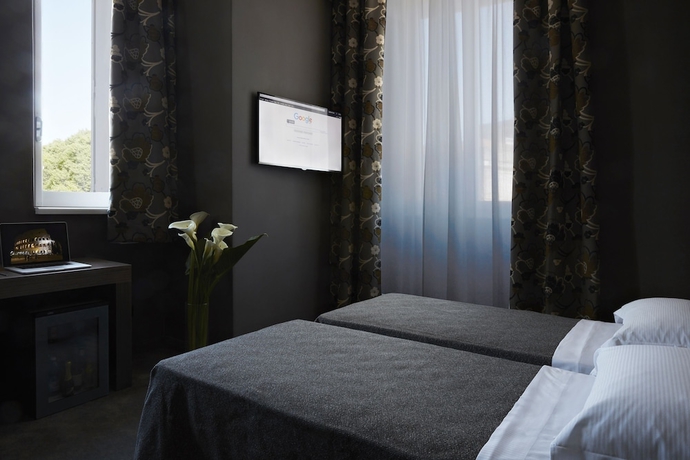 Imagen de la habitación del Hotel The Building. Foto 11