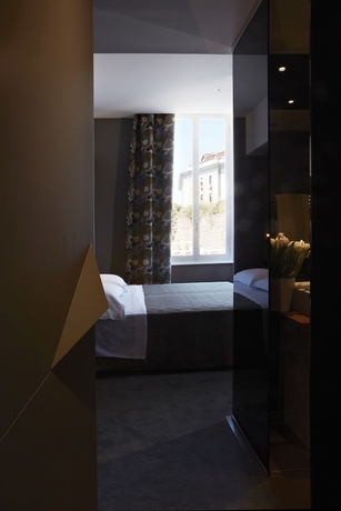 Imagen de la habitación del Hotel The Building. Foto 12