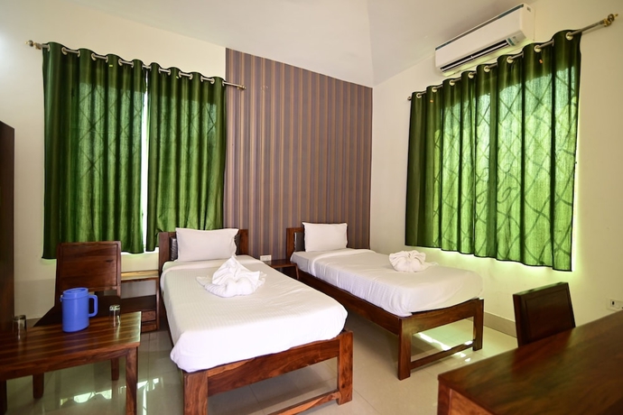 Imagen de la habitación del Hotel The Byke Niranjana Resort. Foto 11