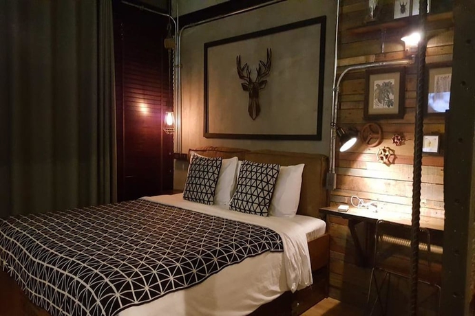 Imagen de la habitación del Hotel The Cabin Beach Resort. Foto 9