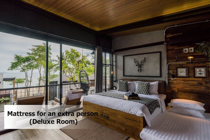 Imagen de la habitación del Hotel The Cabin Beach Resort. Foto 18