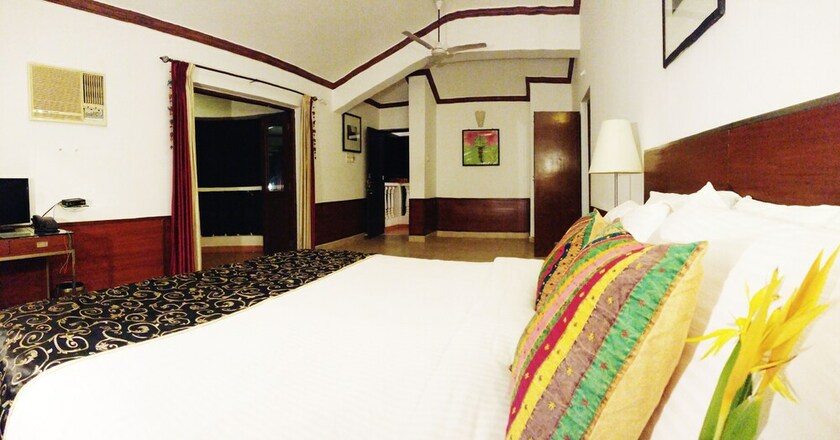 Imagen de la habitación del Hotel The Camelot Beach Resort. Foto 16