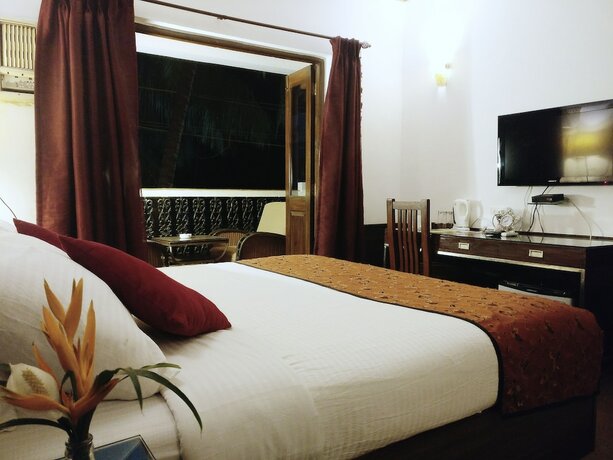 Imagen de la habitación del Hotel The Camelot Beach Resort. Foto 19